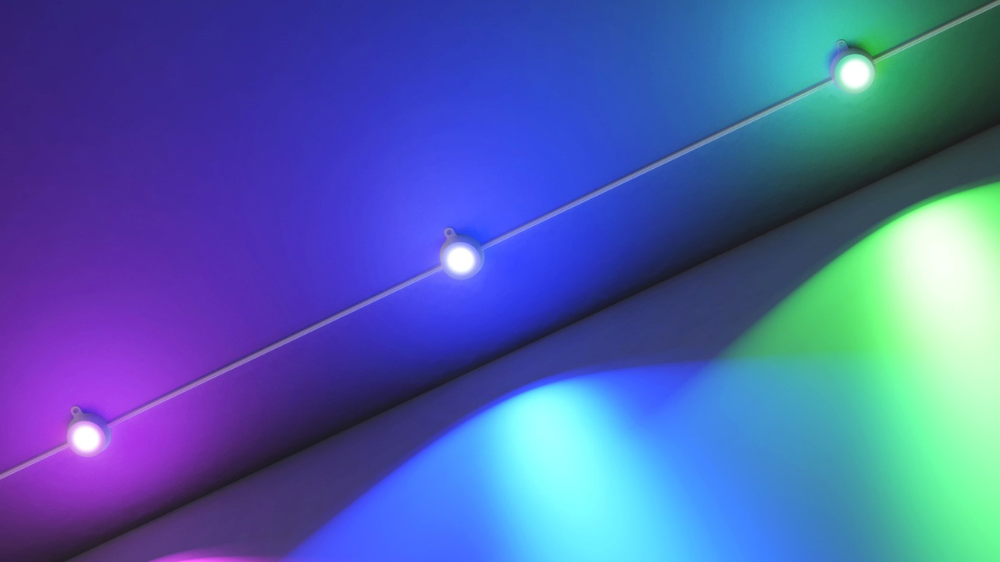 Smart permanent string lights glowing in multiple colors.