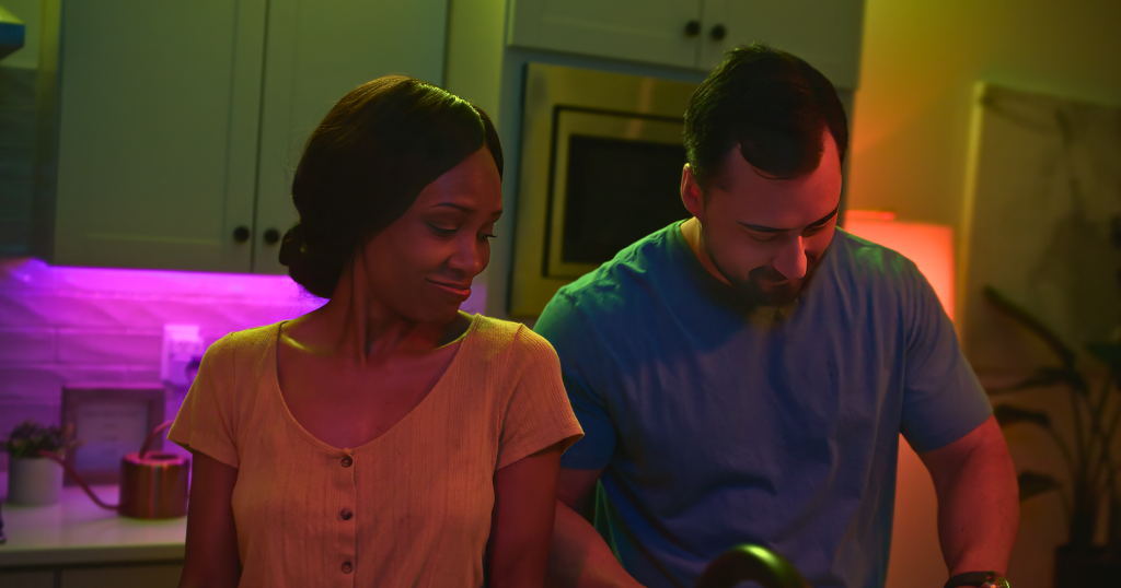 Man and woman washing dishes at home.